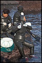 Haeneyo women arranging wetsuits. Jeju Island, South Korea ( color)