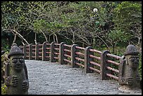 Footbridge and Dolharubang statues, Seogwipo. Jeju Island, South Korea ( color)