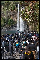 Crowd at the base of waterfall, Jeongbang Pokpo, Seogwipo. Jeju Island, South Korea ( color)