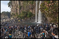 Tourists at the base of Jeongbang Pokpo falls, Seogwipo. Jeju Island, South Korea ( color)