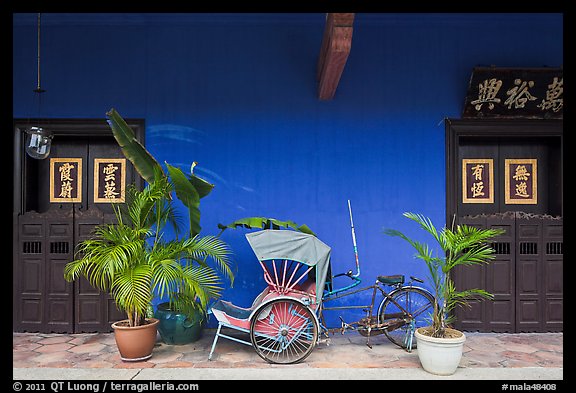 Trishaw and doors, Cheong Fatt Tze Mansion. George Town, Penang, Malaysia (color)