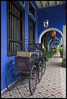 Rickshaws in front gallery, Cheong Fatt Tze Mansion. George Town, Penang, Malaysia (color)