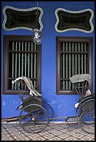 Rickshaws and windows, Cheong Fatt Tze Mansion. George Town, Penang, Malaysia (color)