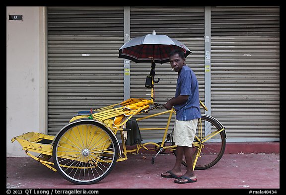 Driver and trishaw. George Town, Penang, Malaysia