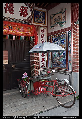 Bicycle rickshaw at temple entrance. George Town, Penang, Malaysia (color)