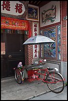 Bicycle rickshaw at temple entrance. George Town, Penang, Malaysia