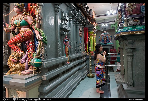 Woman worshipping at Sri Mariamman Temple. George Town, Penang, Malaysia