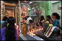 Devotees inside Tamil Nadu temple. George Town, Penang, Malaysia ( color)