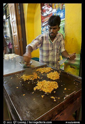 Man preparing indian food. George Town, Penang, Malaysia (color)