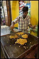 Man preparing indian food. George Town, Penang, Malaysia (color)