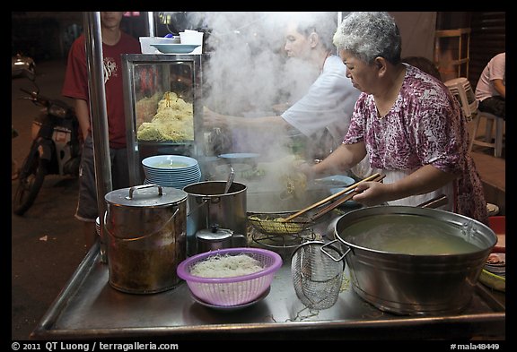 Noddles prepared on foodstall by night. George Town, Penang, Malaysia