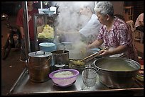 Noddles prepared on foodstall by night. George Town, Penang, Malaysia (color)