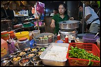 Woman serving dumplings. George Town, Penang, Malaysia ( color)