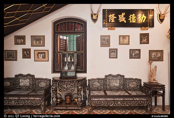 Antique furniture and images, Pinang Peranakan Mansion. George Town, Penang, Malaysia (color)