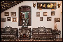 Antique furniture and images, Pinang Peranakan Mansion. George Town, Penang, Malaysia (color)