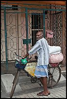 Malay with loaded bicycle. George Town, Penang, Malaysia (color)