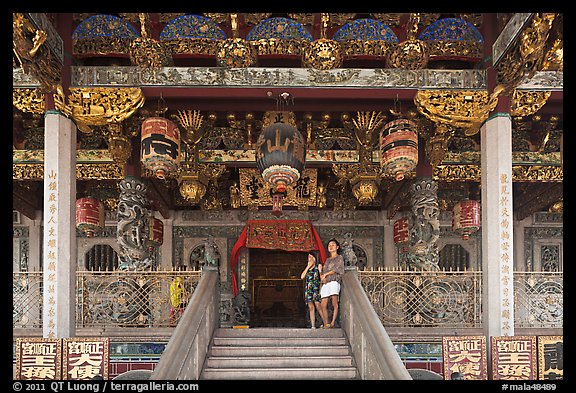 Women standing at Khoo Kongsi entrance. George Town, Penang, Malaysia