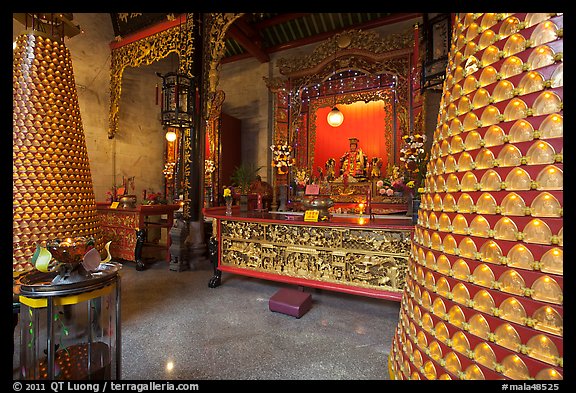 Wishing wheels and altar, Hainan Temple. George Town, Penang, Malaysia