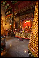 Altar and wheels in motion, Hainan Temple. George Town, Penang, Malaysia