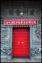 Crimson door and slate wall, Hainan Temple. George Town, Penang, Malaysia (color)