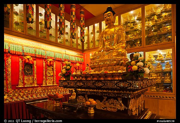 Buddha image inside Yellow Hat Buddhist temple. George Town, Penang, Malaysia (color)