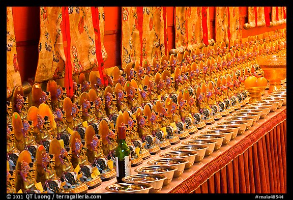 Rows of Jambhala figures, Gelugpa Buddhist Association temple. George Town, Penang, Malaysia (color)