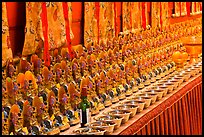 Rows of Jambhala figures, Gelugpa Buddhist Association temple. George Town, Penang, Malaysia