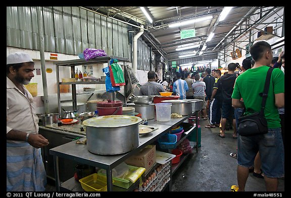 People waiting in line at popular eatery. George Town, Penang, Malaysia (color)