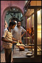 Man preparing nan bread in arcade. George Town, Penang, Malaysia (color)