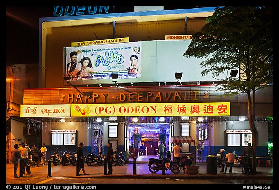 Movie theater showing Bollywood films at night. George Town, Penang, Malaysia (color)