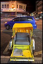 Rickshaw and auto at night. George Town, Penang, Malaysia