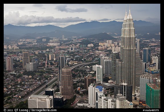 Skyline with Petronas Towers seen from Menara KL. Kuala Lumpur, Malaysia (color)