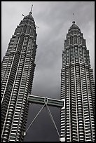 Petronas Towers (tallest twin towers in the world) and stormy sky. Kuala Lumpur, Malaysia