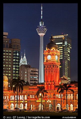 Sultan Abdul Samad Building, Petronas Towers, and Menara KL at night. Kuala Lumpur, Malaysia (color)