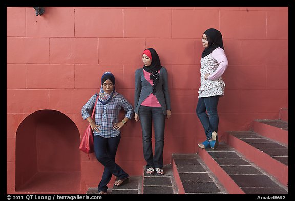 Young women with islamic headscarfs and modern fashions. Malacca City, Malaysia (color)