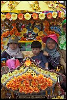 Malay children riding on trishaw. Malacca City, Malaysia ( color)