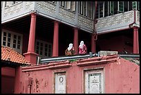 Stadthuys detail with two women. Malacca City, Malaysia ( color)