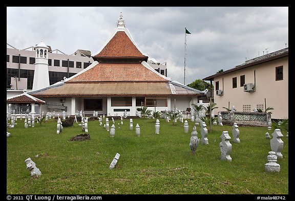 Cemetery, Mosque, and Moorish watchtower minaret. Malacca City, Malaysia