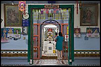 Women worshipping Hindu deity Vinayaga, Sri Poyyatha Vinayagar Moorthi. Malacca City, Malaysia ( color)