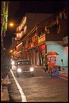 Car and bicycle rickshaw at night. Malacca City, Malaysia (color)