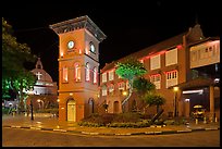 Town Square with Stadthuys, clock tower, and church at night. Malacca City, Malaysia (color)