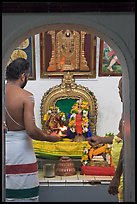 Holy men lighting fire, Sri Poyyatha Vinayagar Moorthi Temple. Malacca City, Malaysia (color)