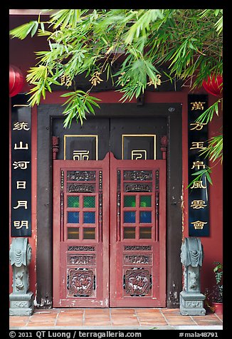 Weathered door with chinese signs and lanterns. Malacca City, Malaysia (color)