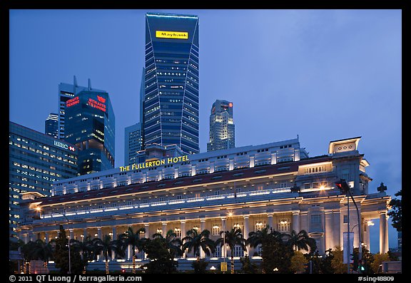 Fullerton Hotel and high rises at dusk. Singapore (color)