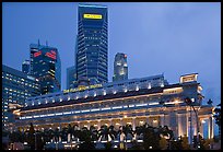 Fullerton Hotel and high rises at dusk. Singapore ( color)