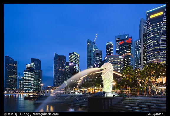 Merlion fountain and skyline at dusk. Singapore