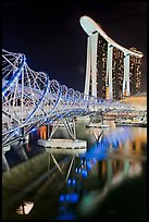 Helix Bridge and Marina Bay Sands hotel at night. Singapore (color)