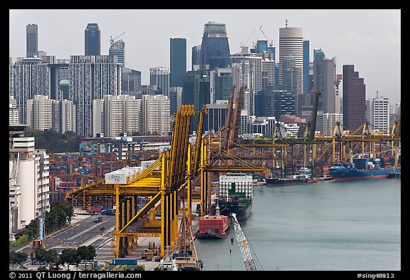 Cranes in harbor and CBD skyscrappers. Singapore (color)