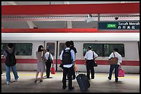 Passengers preparing to board MRT train. Singapore