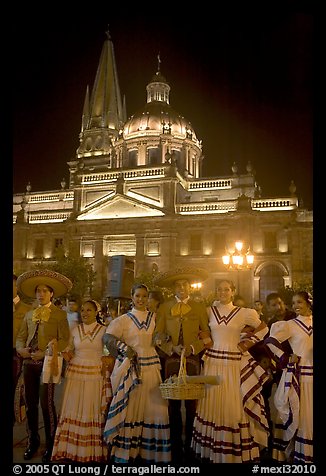 Men and women in traditional mexican costume with Cathedral in background. Guadalajara, Jalisco, Mexico (color)